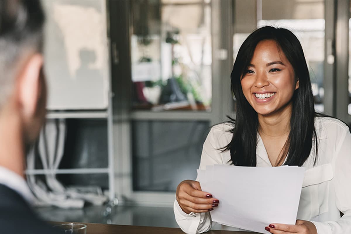 Woman smiling in an interview