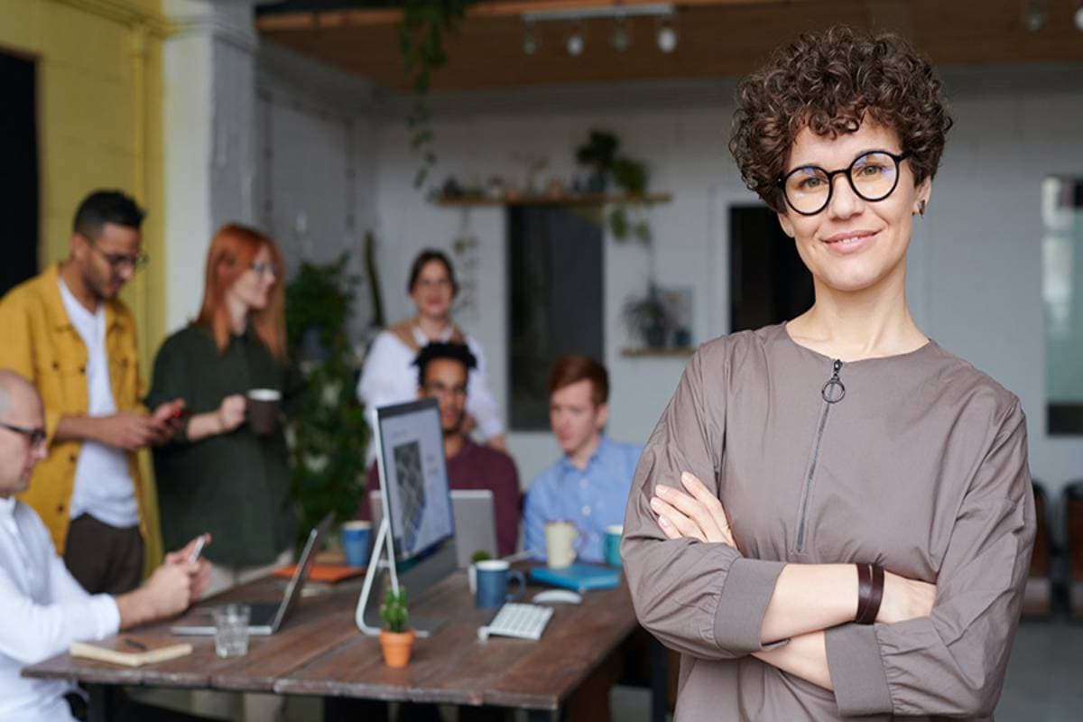 Woman standing in front of team